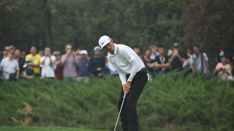 Li Haotong of China  putts