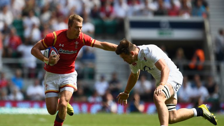 Liam Williams of Wales is tackled by Jack Clifford of England