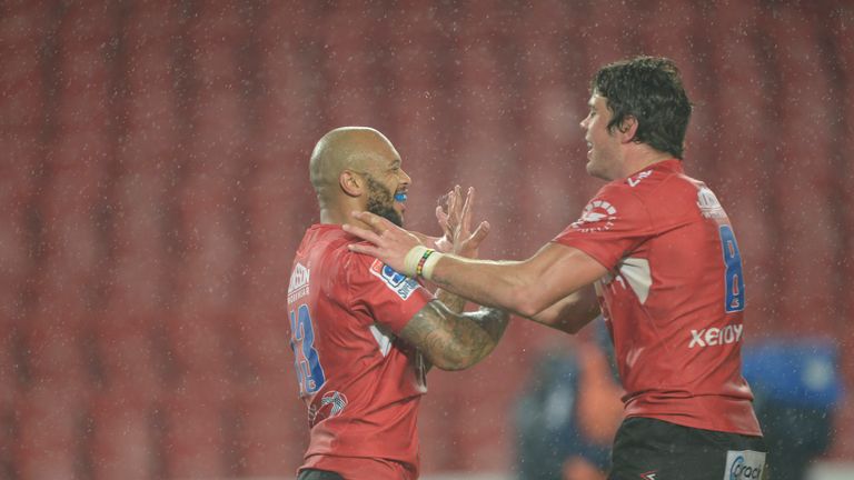 Lionel Mapoe celebrates one of his three tries with Warren Whiteley (r)
