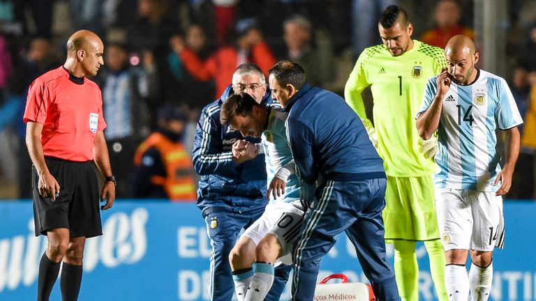 Lionel Messi is assisted after being injured during a the friendly win over Honduras