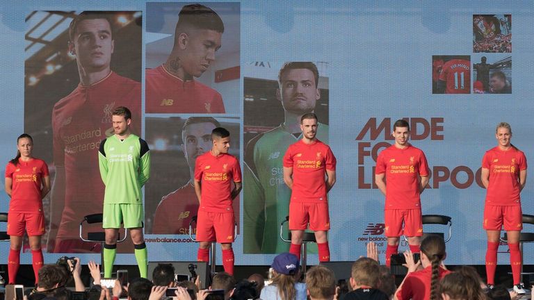 Liverpool and Liverpool Ladies players show off their new kit at a ceremony in the city