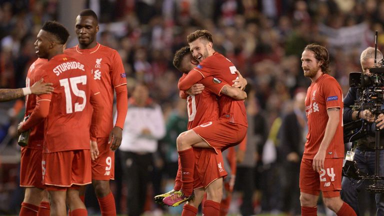 Liverpool's English midfielder Adam Lallana (3rd R) celebrates at the final whistle