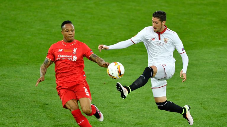Liverpool's English defender Nathaniel Clyne (L) vies for the ball with  Sevilla's Spanish defender Sergio Escudero