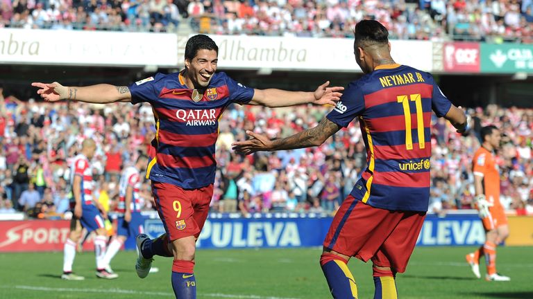 Luis Suarez celebrates his hat-trick goal with team-mate Neymar