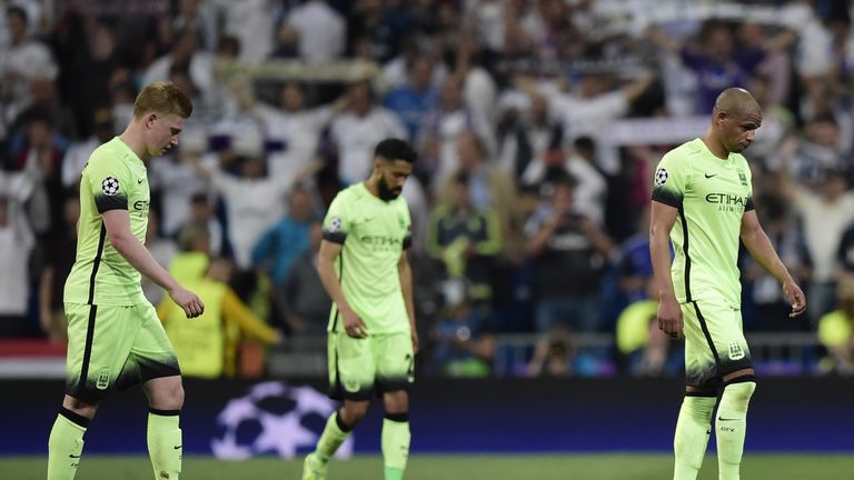 Manchester City players walk at the end the UEFA Champions League semi-final second leg football match Real Madrid CF vs Manchester City FC at the Santiago