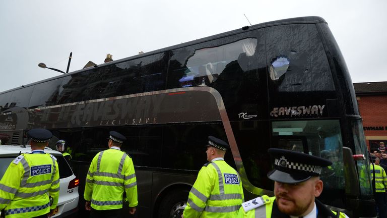 The bus carrying the Manchester United team is escorted by police after having a window smashed on its way to West Ham's Boleyn Ground.
