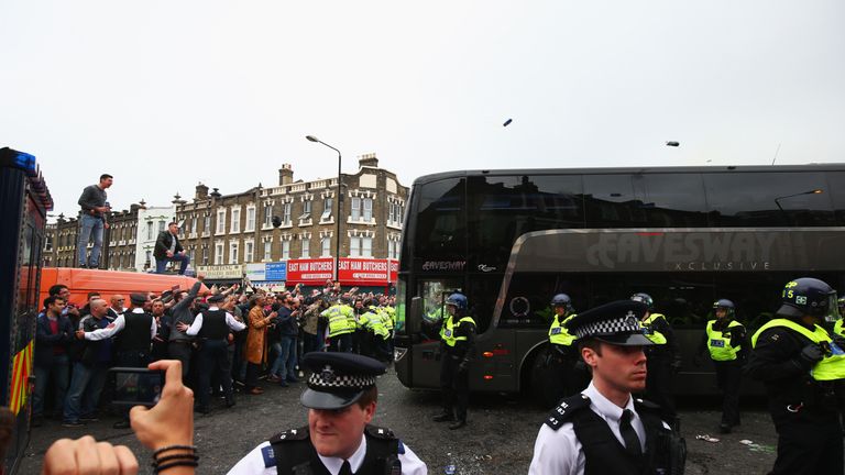 The Manchester United team coach attempts to make its way through the crowds prior to the Barclays Premier League match v West Ham at the Boleyn Ground