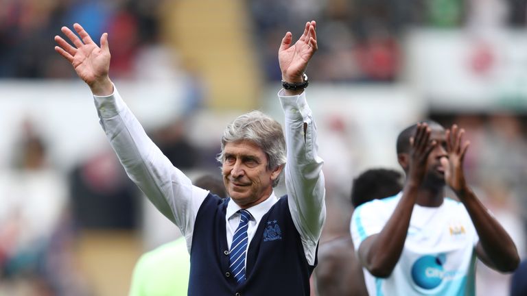 Manuel Pellegrini, manager of Manchester City waves to fans after the Barclays Premier League match between Swansea City and Manchester City