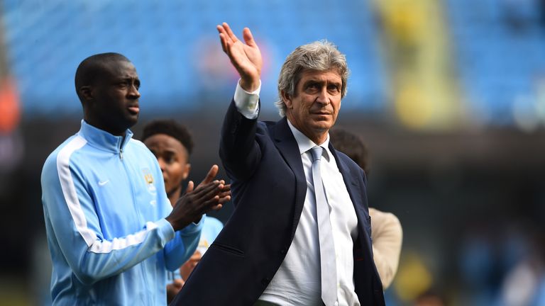 MANCHESTER, ENGLAND - MAY 08:  Manuel Pellegrini, Manager of Manchester City acknowledges the fans followin the Barclays Premier League match between Manch