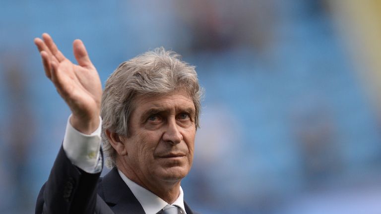 Manchester City's Chilean manager Manuel Pellegrini applauds the fans after the English Premier League football match between Manchester City and Arsenal a