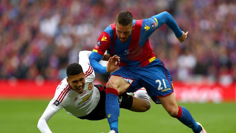 Chris Smalling of Manchester United and Connor Wickham of Crystal Palace
