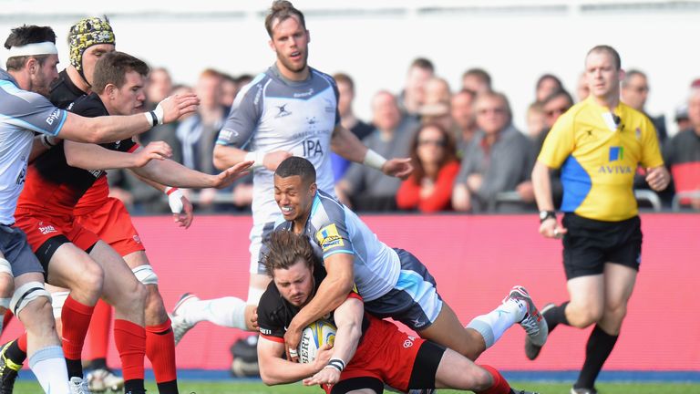 Ben Ransom of Saracens is tackled by Marcus Watson of Newcastle Falcons during the Aviva Premiership match between Saracens and Newcastle Falcons