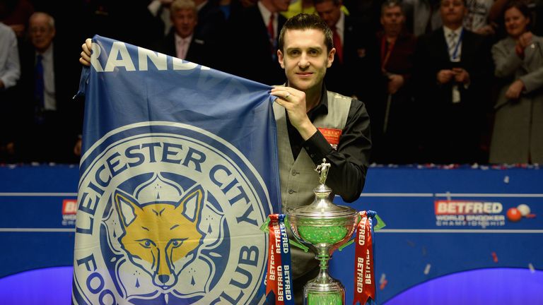 SHEFFIELD, ENGLAND - MAY 02:  Mark Selby with a Leicester City football club flag after lifting the trophy after beating Ding Junhui to win the World Snook