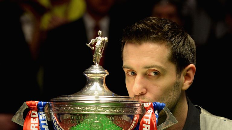 Mark Selby lifts the trophy after beating Ding Junhui to win the World Snooker Championship