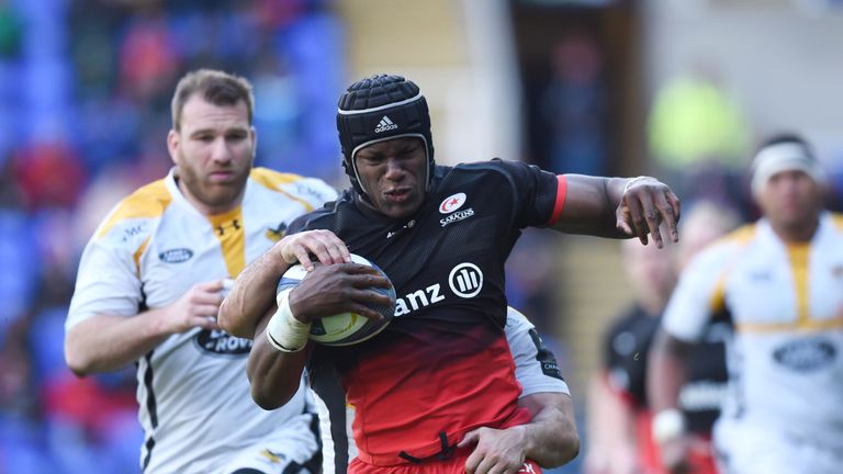 Saracens' lock Maro Itoje is tackled by Wasps' New Zealand full back Charles Piutau 