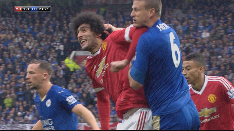 Marouane Fellaini clashes with Robert Huth during Manchester United's Premier League game against Leicester