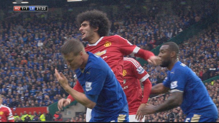 Marouane Fellaini clashes with Robert Huth during Manchester United's Premier League game against Leicester