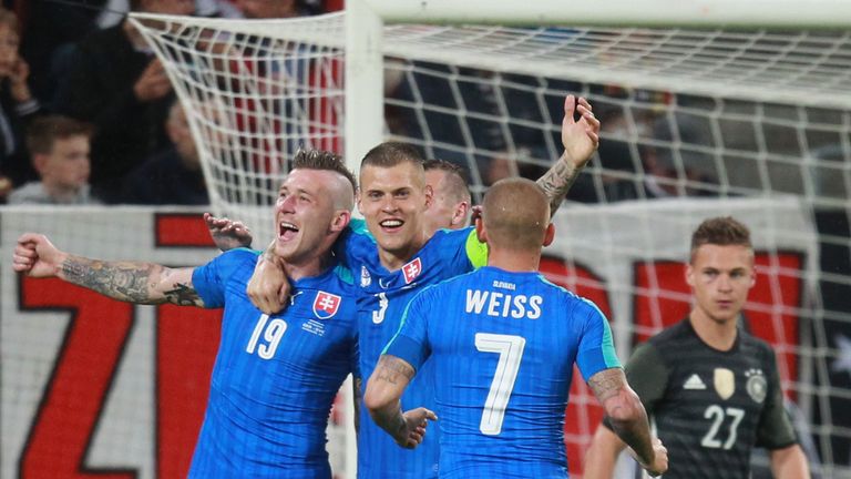 Juray Kucka (L) celebrates scoring with Slovakia captain Martin Skrtel against Germany at WWK-Arena on May 29, 2016 in Augsburg, Germany.