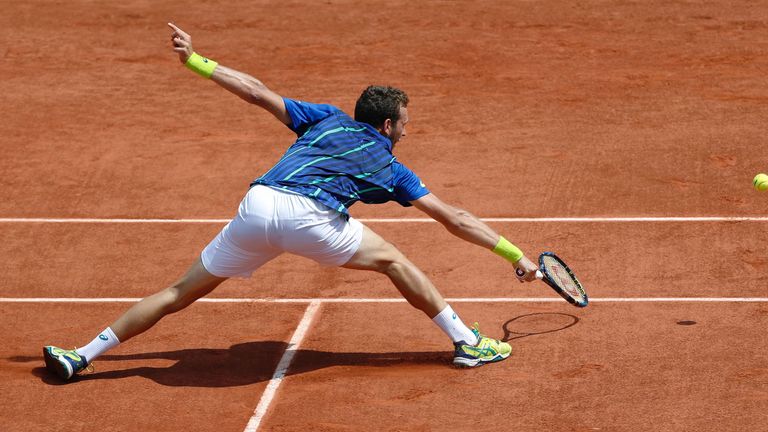 Mathias Bourgue returns the ball to Andy Murray during their men's second round match at the Roland Garros 2016 French Tennis Open
