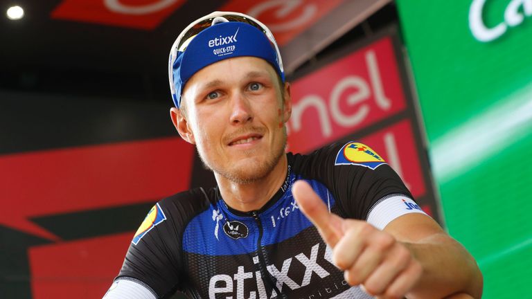 Italy's rider Matteo Trentin celebrates on the podium  after winning the 18th stage of the 99th Giro d'Italia, Tour of Italy, from Muggio to Pinerolo on Ma