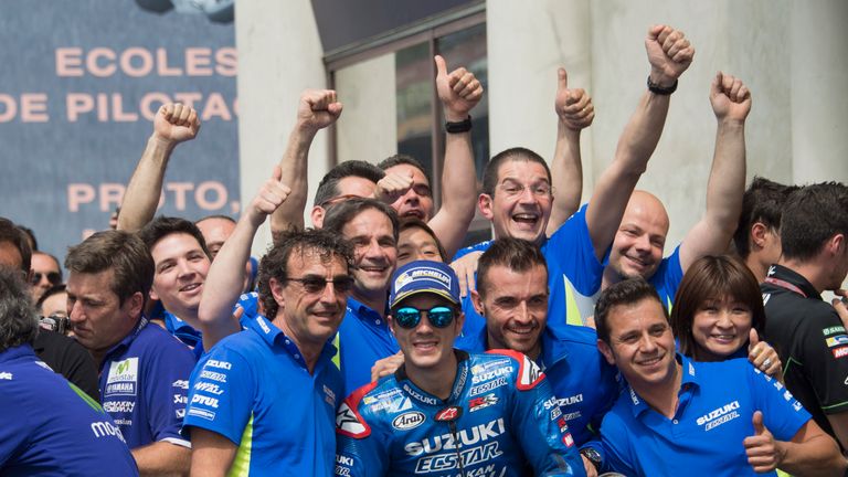  Maverick Vinales of Spain and Team Suzuki ECSTAR celebrates the third place under the podium at the end of the MotoGP race durin