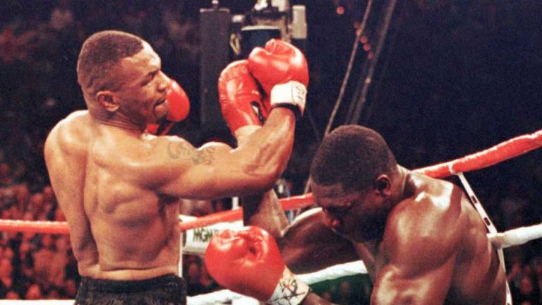 Mike Tyson (L) retired Frank Bruno with a brutal stoppage