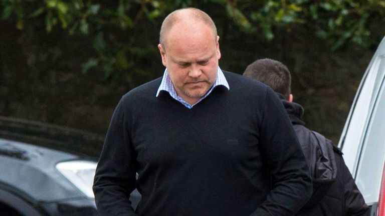Mixu Paatelainen checks his phone at the Dundee United training ground following his dismissal