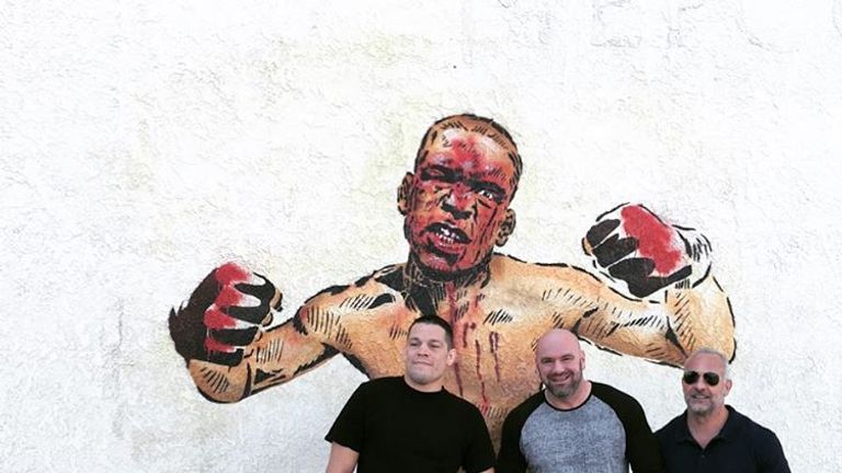 Nate Diaz (R) poses alongside Dana White (C) and Lorenzo Fertita (R) at a newly-painted mural in Stockton. Credit: Instagram: natediaz209