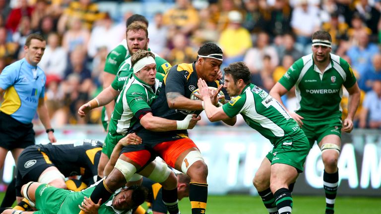 Nathan Hughes of Wasps is tackled by Luke Narraway and Brendan McKibbin of London Irish 