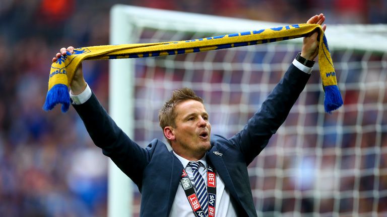 Neal Ardley, manager of  AFC Wimbledon celebrates after their victory