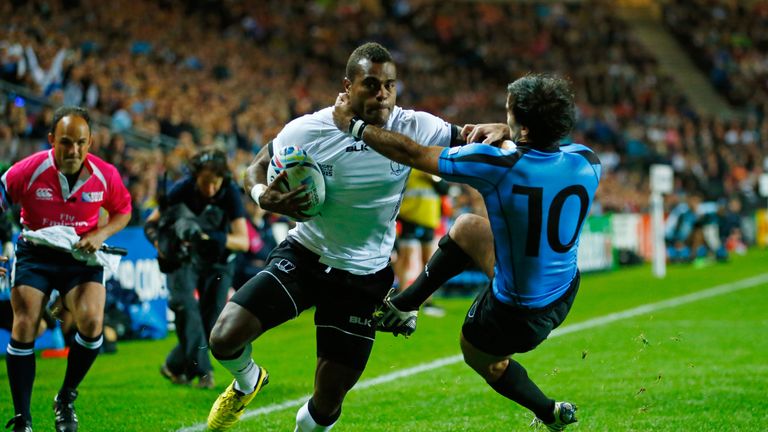 Nemia Kenatale of Fiji holds off Alejo Duran of Uruguay as he scores their second try during the 2015 Rugby World Cup