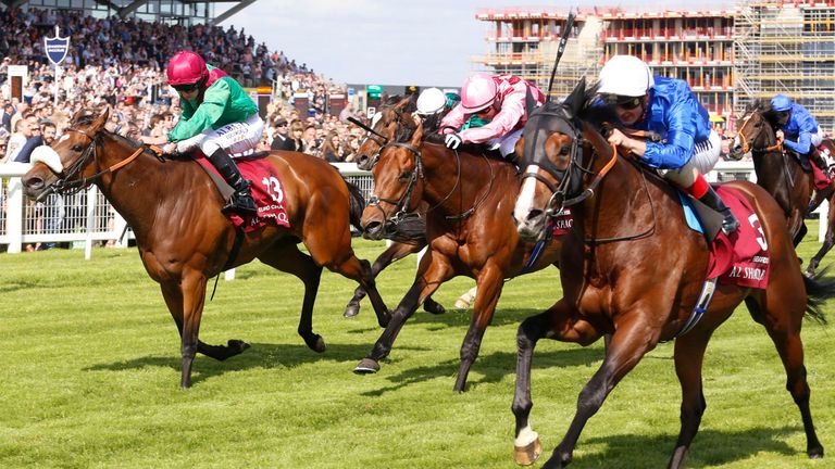 Belardo (right), ridden by Andrea Atzeni, comes with a late run to win the Al Shaqab Lockinge Stakes at Newbury