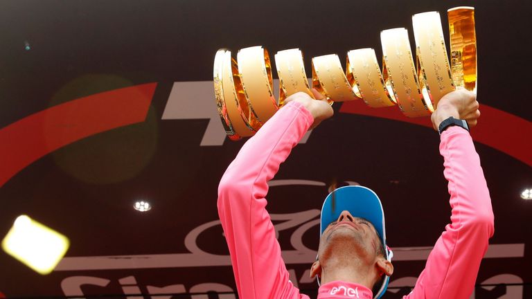 Italy's Vincenzo Nibali celebrates with the trophy on the podium after winning the 99th Giro d'Italia, Tour of Italy, after the 21th stage from Cuneo to Tu