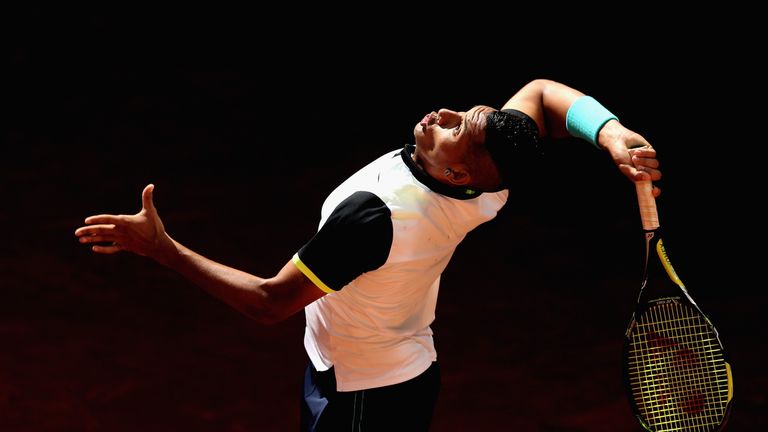 Nick Kyrgios of Australia serves against John Isner of the United States in their third round match during day six of the Mutua Ma