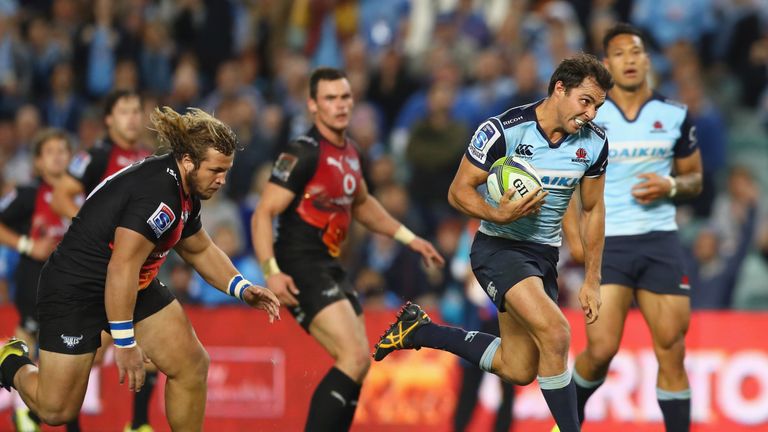 Nick Phipps of the Waratahs breaks away to score a try against the Bulls