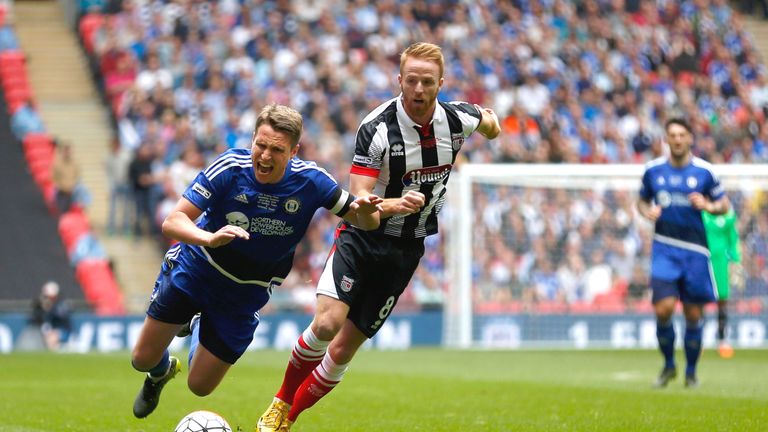 LONDON, ENGLAND - MAY 22: Nicky Wroe of FC Halifax Town is fouled by Craig Disley of Grimsby Town during the FA Trophy Final match between Grimsby Town FC 
