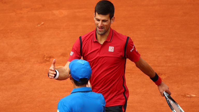 Novak Djokovic shakes hands with Yen-Hsun Lu