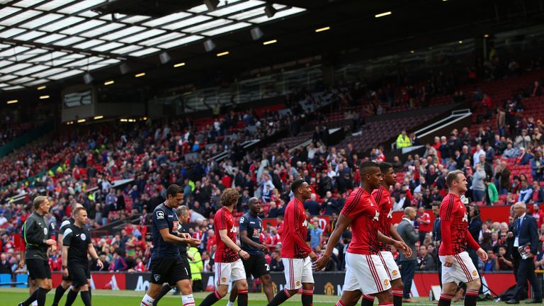 Players leave the field before Manchester United's match against Bournemouth was postponed
