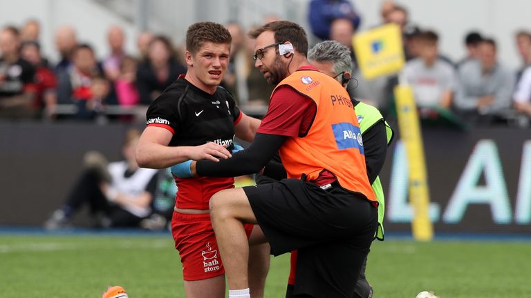 Owen Farrell of Saracens is treated for an injury