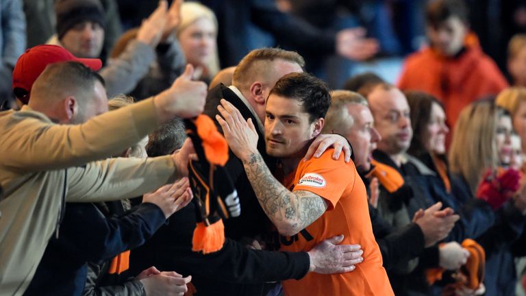 Paul Paton and supporters commiserate each other following Dundee United's relegation
