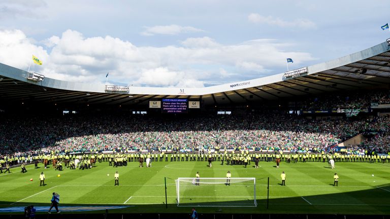 Police formed a line across the pitch at Hampden park