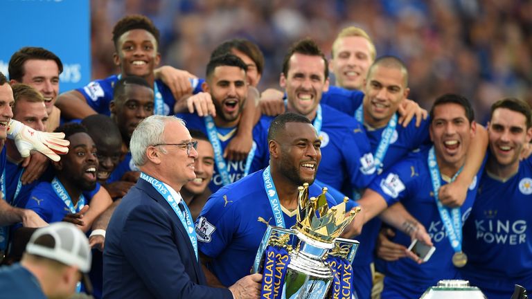 Captain Wes Morgan and manager Claudio Ranieri of Leicester City prepare to lift the Premier League Trophy after the Barclays