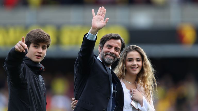 Quique Flores, manager of Watford, waves to supporters 