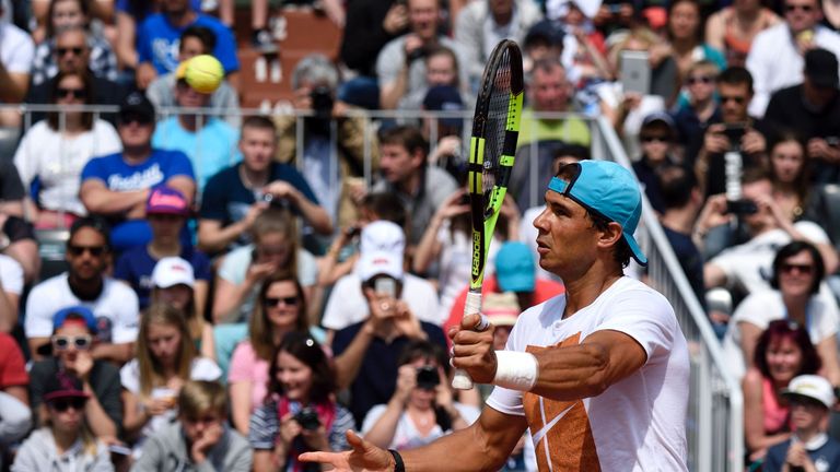 Spain's Rafael Nadal returns the ball during a training session ahead of the French tennis Open on May 21, 2016 at Roland Garros stadium in Paris. / AFP / 