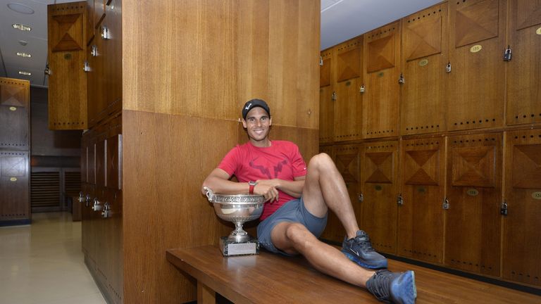 Rafael Nadal of Spain poses in the locker room with the Coupe des Mousquetaires trophy after the men's singles final against Nova