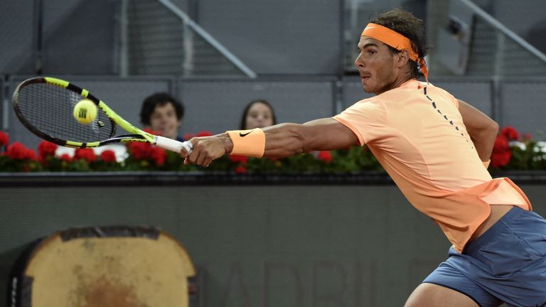 Spanish tennis player Rafael Nadal returns a ball to Portuguese tennis player Joao Sousa during the Madrid Open tournament at the Caja Magica (Magic Box) s
