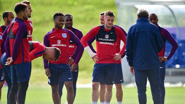 Raheem Sterling and Jamie Vardy listen to Roy Hodgson the England manager
