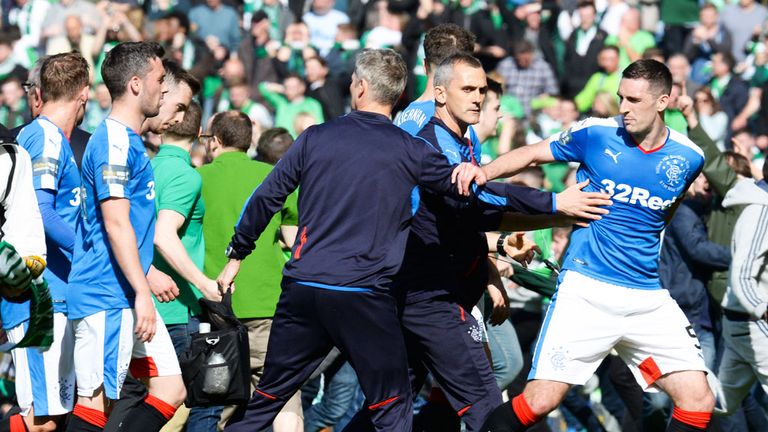 Rangers players and coaching staff leave the pitch at Hampden