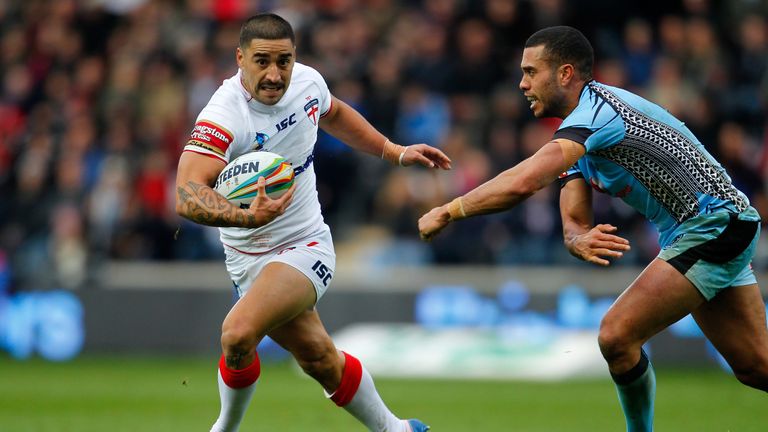 England's Rangi Chase (L) in action with Fiji's Ryan Millard during the Rugby League World Cup Group A match at the KC Stadium