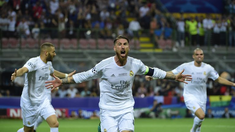 Real Madrid's Spanish defender Sergio Ramos (C) celebrates after scoring the opening goal